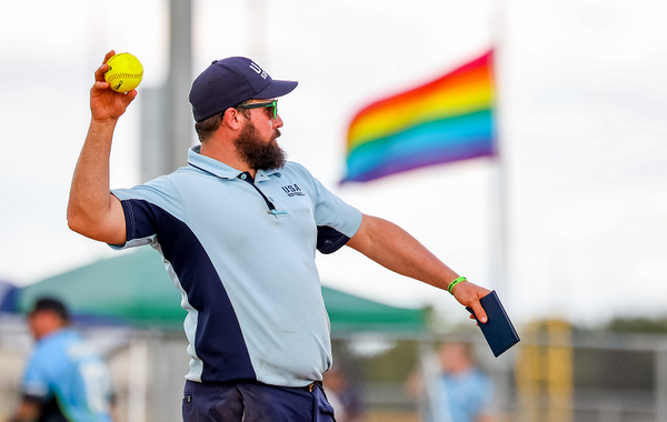 Umpire throwing softball